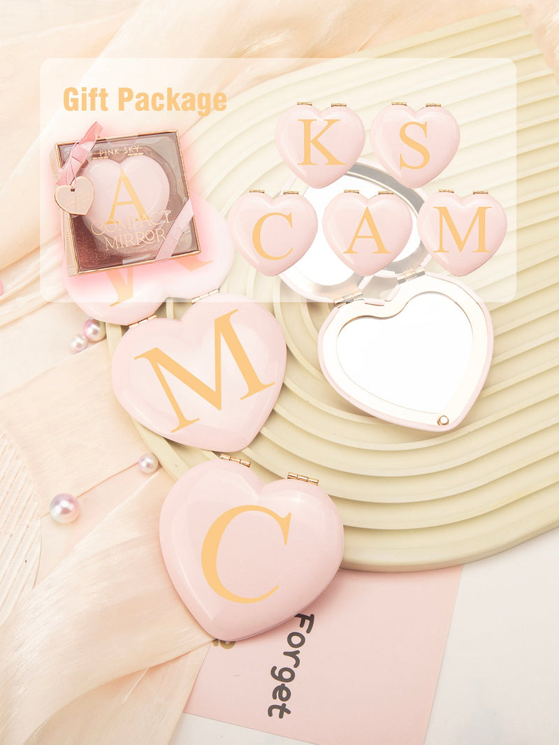 Pink heart-shaped CHOIZIN compact mirror with a printed initial