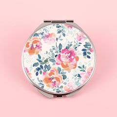 The silver plated round double-sided makeup mirror has a colored glue drop pattern