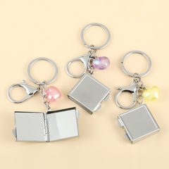 1PC Square Keychain Makeup Mirror Double Side Compact Mirror 2X Magnification The Glue Drop Letter Pattern Is Small And Easy To Carry Suitable As A Gift For Mother Sister And Daughter It Is Easy To Carry And Use At Home Or On The Go