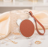 Bear-Head Shaped PU Leather Compact Mirror Keychain - Cute Teddy Bear Double-Sided Folding Travel Mirror with Plastic Frame - Pocket Purse Charm Vanity Mirror with Wrist Lanyard for Women, Girls & Students 🐻✨