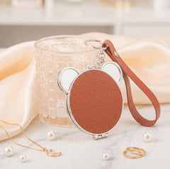 Bear-Head Shaped PU Leather Compact Mirror Keychain - Cute Teddy Bear Double-Sided Folding Travel Mirror with Plastic Frame - Pocket Purse Charm Vanity Mirror with Wrist Lanyard for Women, Girls & Students 🐻✨