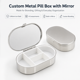 Custom oval metal pill box with mirror and four-compartment ABS insert in bright nickel finish