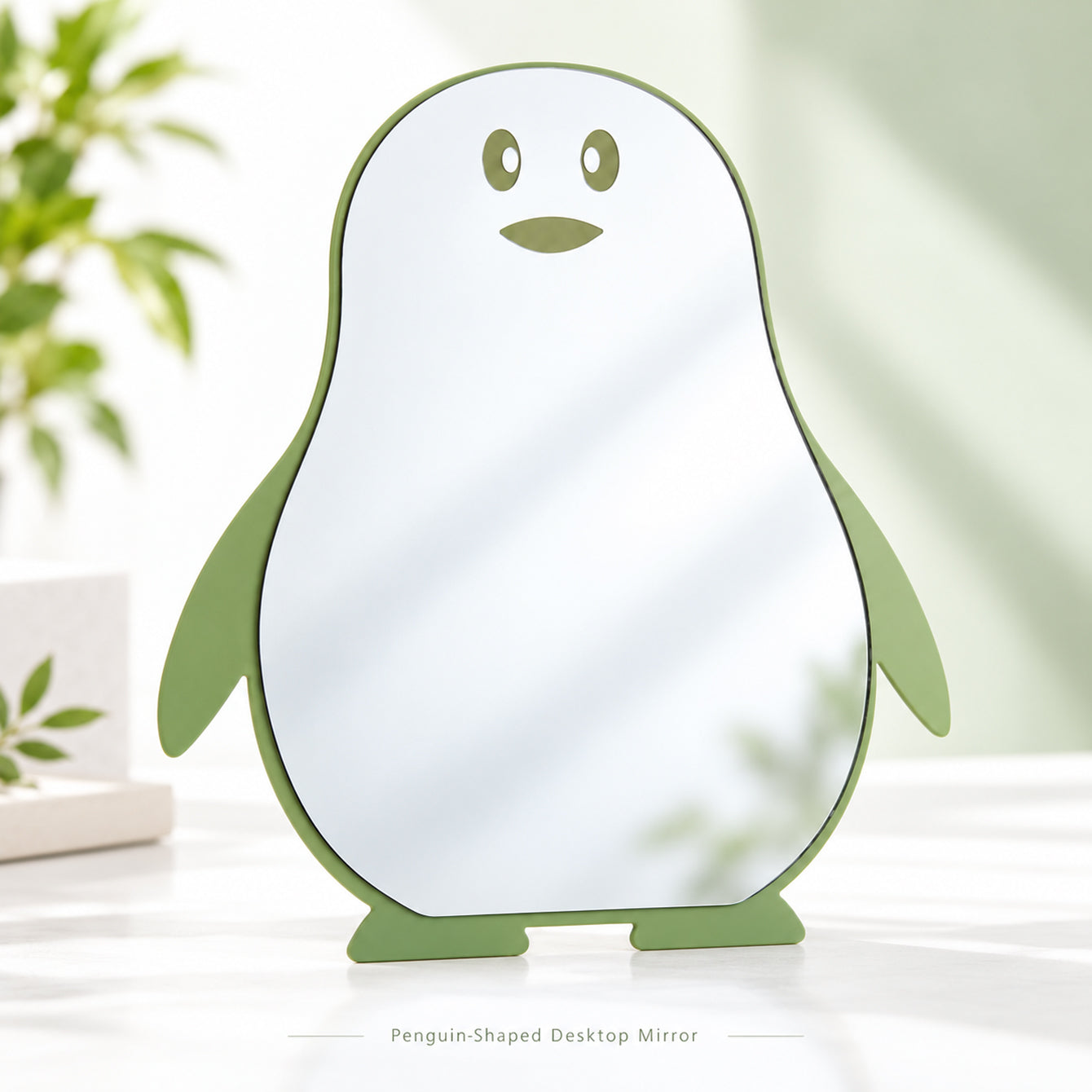 Green penguin-shaped tabletop mirror front view