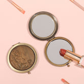 Pocket-sized Beauty Marvel ✨ 70mm Round Dual-sided Makeup Mirror – Antique Green Bronze Finish, Metal Frame, Solid Wood Carvings, Glass Lenses, 2X Magnification. Unveil Your Beauty in Style