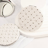 ✨ Trendy 70mm Circular Makeup Mirror, Silver Plated with Heart-shaped Elegant Leather Wrap. Double-sided with 2X Magnification, High-Definition Glass, In Stock for Quick Delivery. Perfect for DIY Beauty! 💄✨"