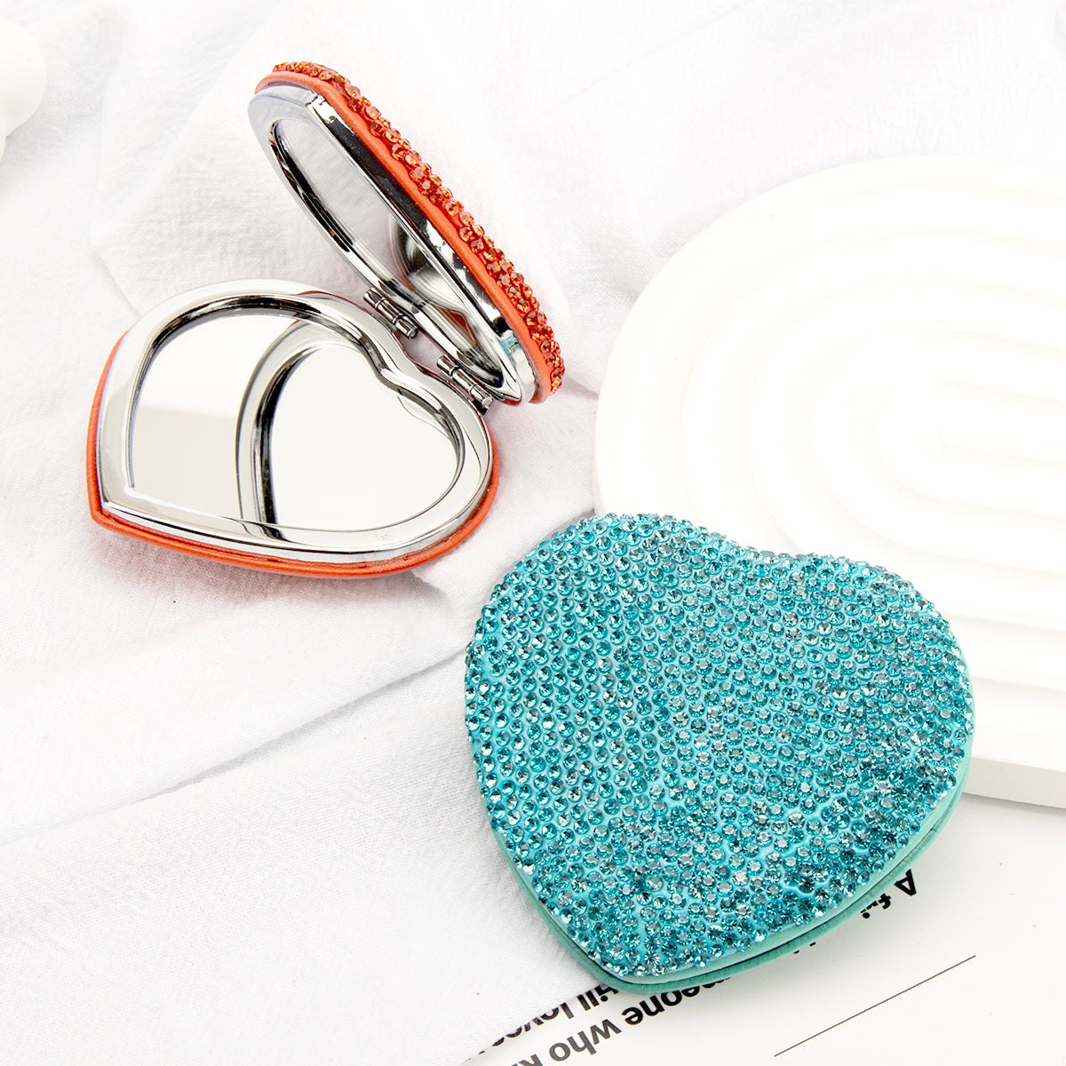 Blue heart shaped rhinestone compact mirror detail
