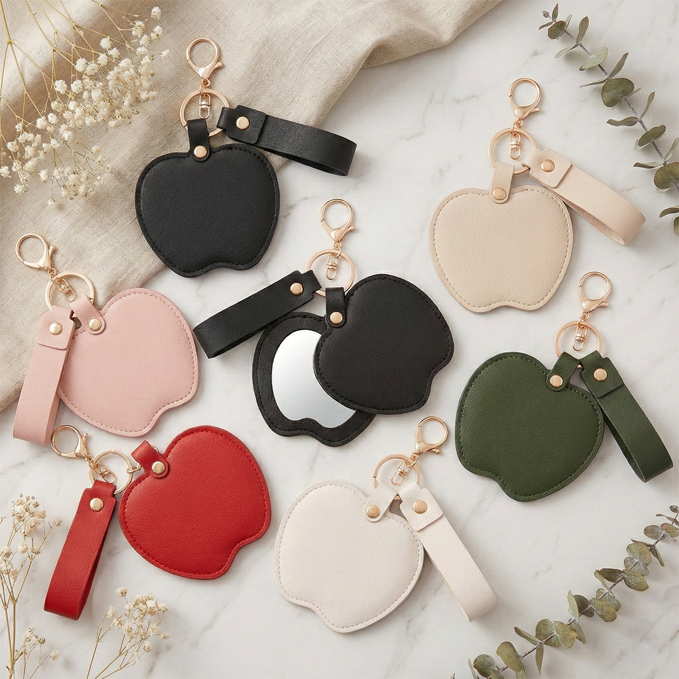Apple-shaped PU leather compact mirror keychain with double-sided glass and swivel folding design