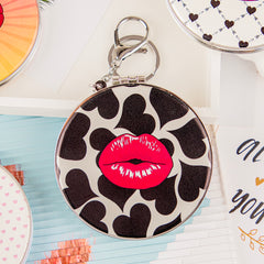 Red lips PU mirror keychain with black hearts on white background