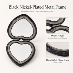 Black nickel-plated metal frame and double hinge detail of heart compact mirror