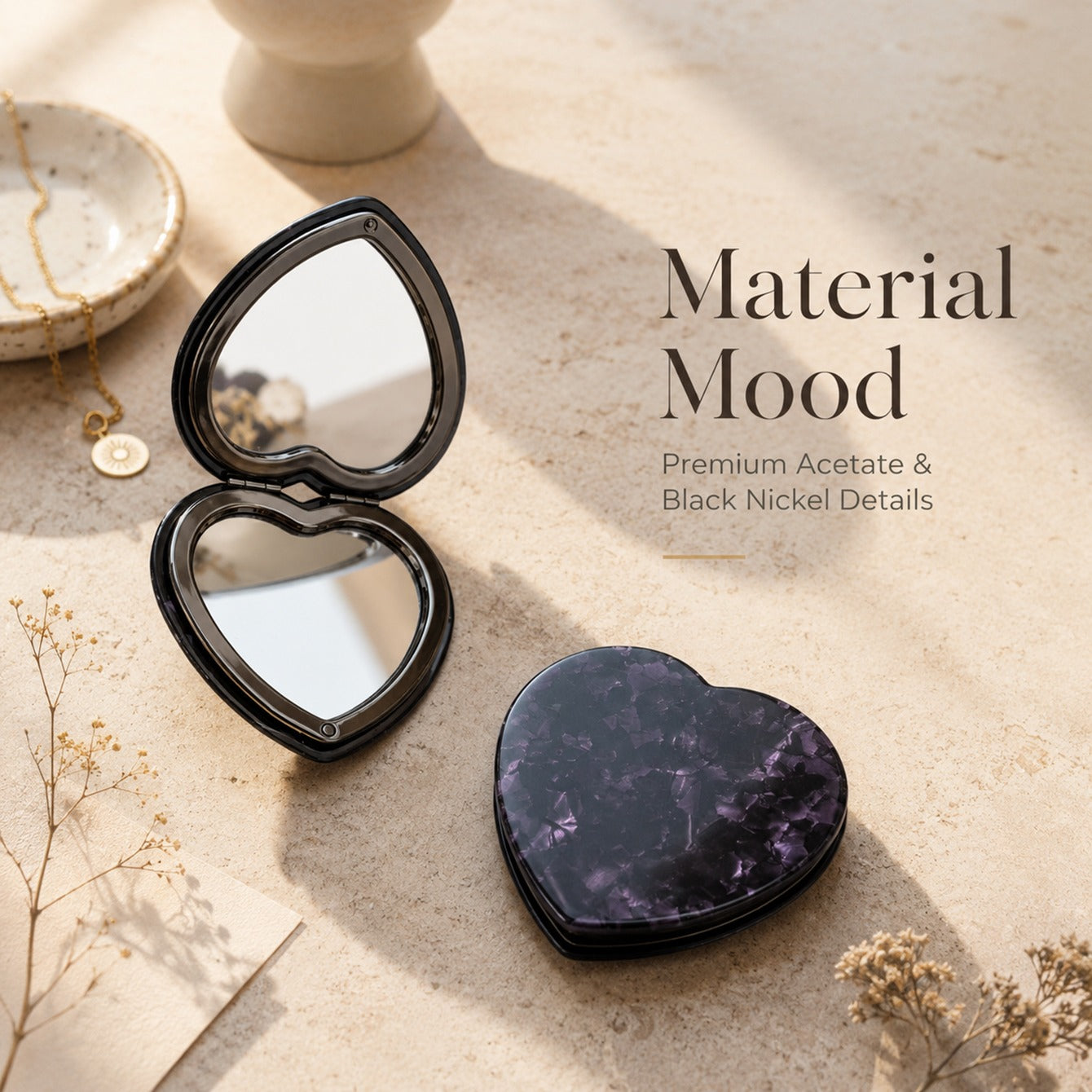 Premium acetate and black nickel details on heart-shaped compact mirror
