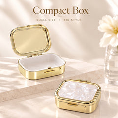 Open small gold-tone storage box showing pills as a usage illustration