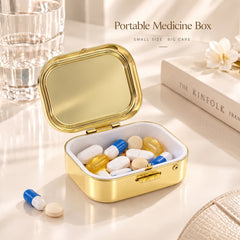 Open small pearl-effect storage box holding rings and jewelry