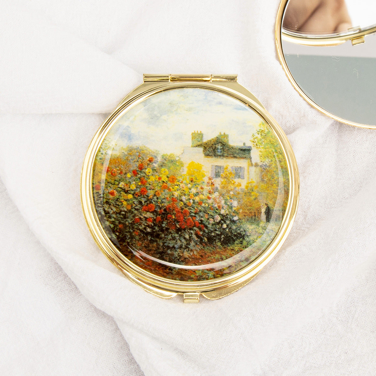 Gold folding compact mirror with floral garden painting