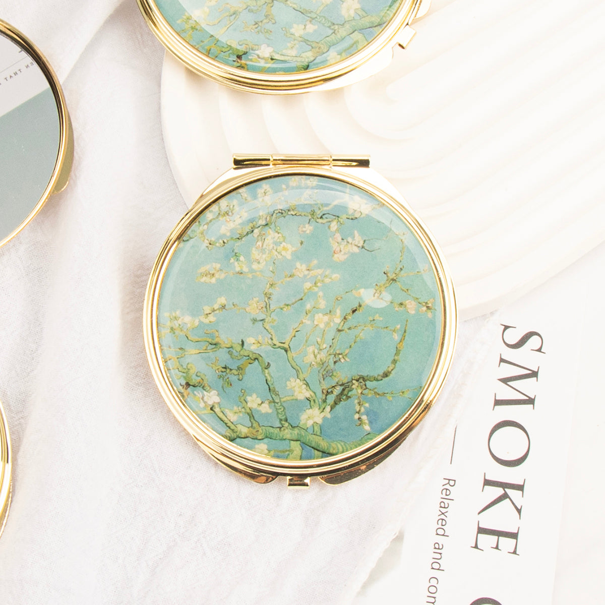 Gold folding compact mirror with almond blossom painting