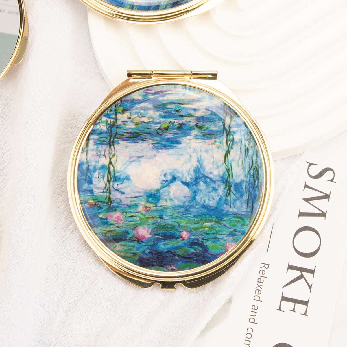 Gold folding compact mirror with water garden painting