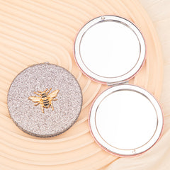 1 PC Round Dual-Sided Powder Makeup Mirror Metal Frame With Elegant Bee Decoration Compact Portable Design Ideal For Precision Makeup Perfect Gift For Mother Sister Friend Suitable For Home Office Travel And More