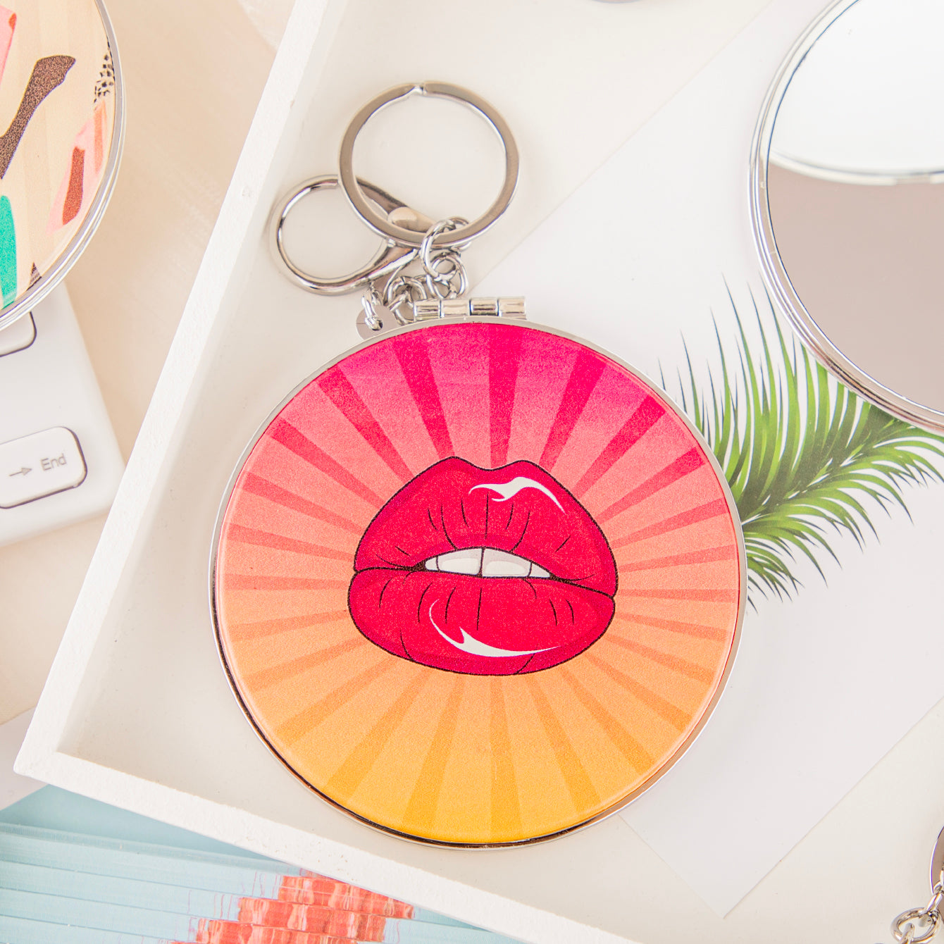 Red lips PU mirror keychain with pink and orange radial background