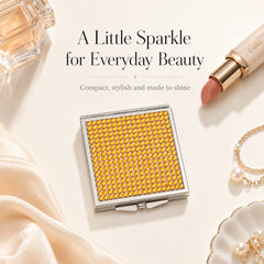 Yellow rhinestone compact mirror in a beauty lifestyle setting